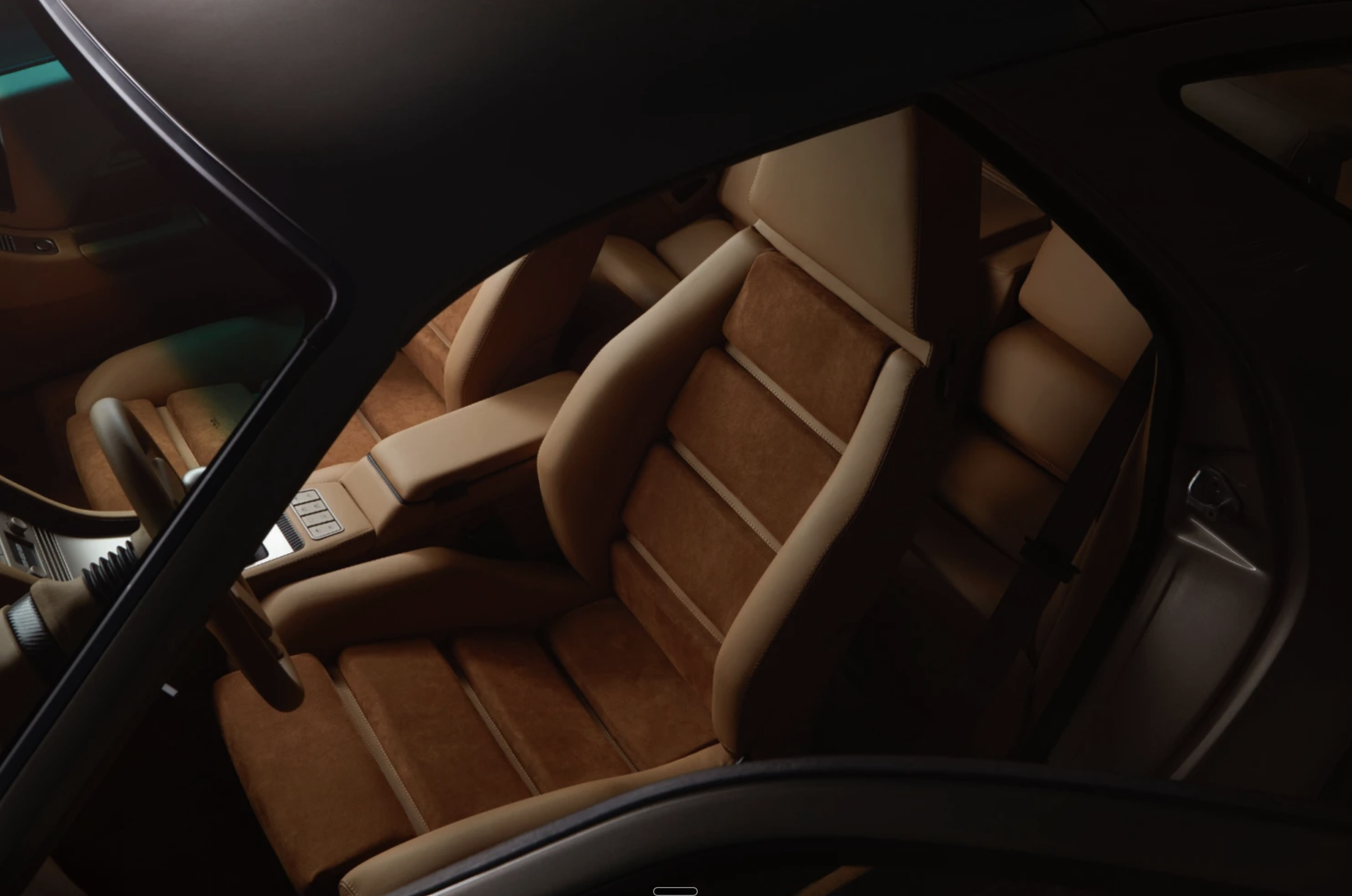 Luxury sports car parked in dramatic lighting